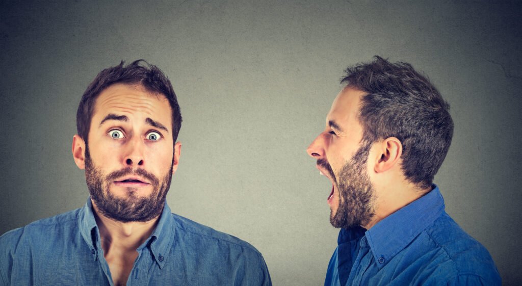 An angry and scared man screaming.